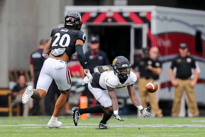 Sep 10, 2022; Cincinnati, Ohio, USA; Kennesaw State Owls running back Iaan Cousin (1) catches a pass against Cincinnati Bearcats linebacker Deshawn Pace (20) in the first half at Nippert Stadium. Mandatory Credit: Katie Stratman-USA TODAY Sports